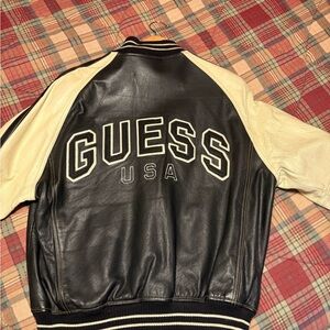 Vintage GUESS Black and cream Men's Jacket
Size small.